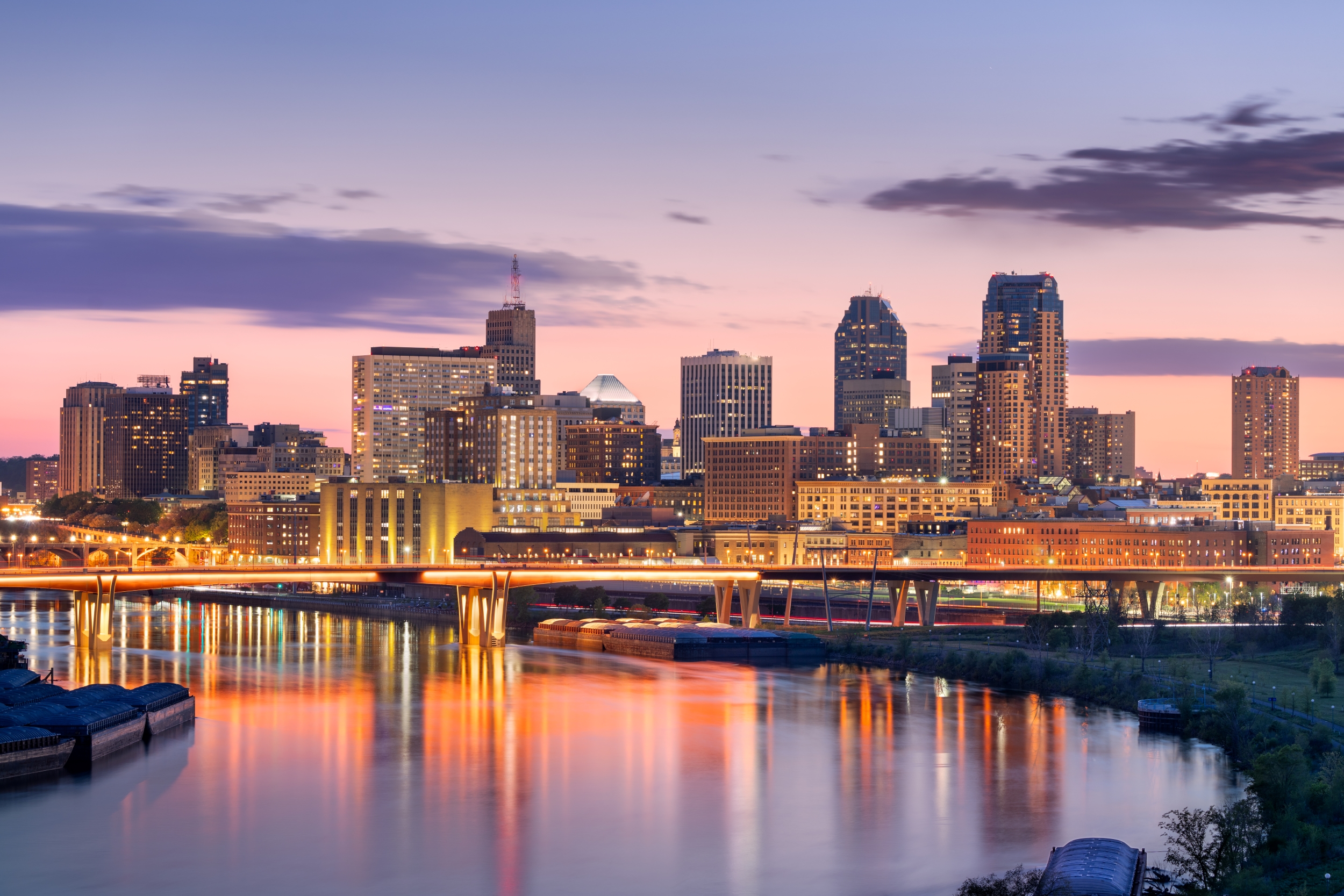 Saint Paul, Minnesota, USA downtown skyline on the Mississippi River at dusk.