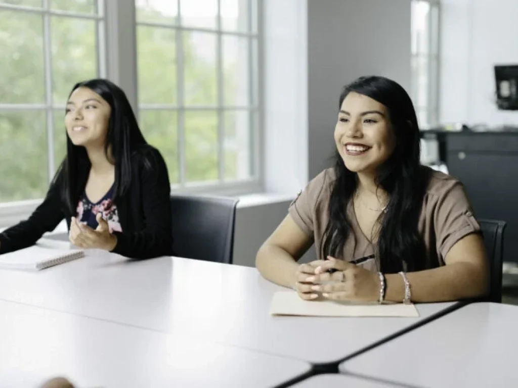 two students interviewing for a role